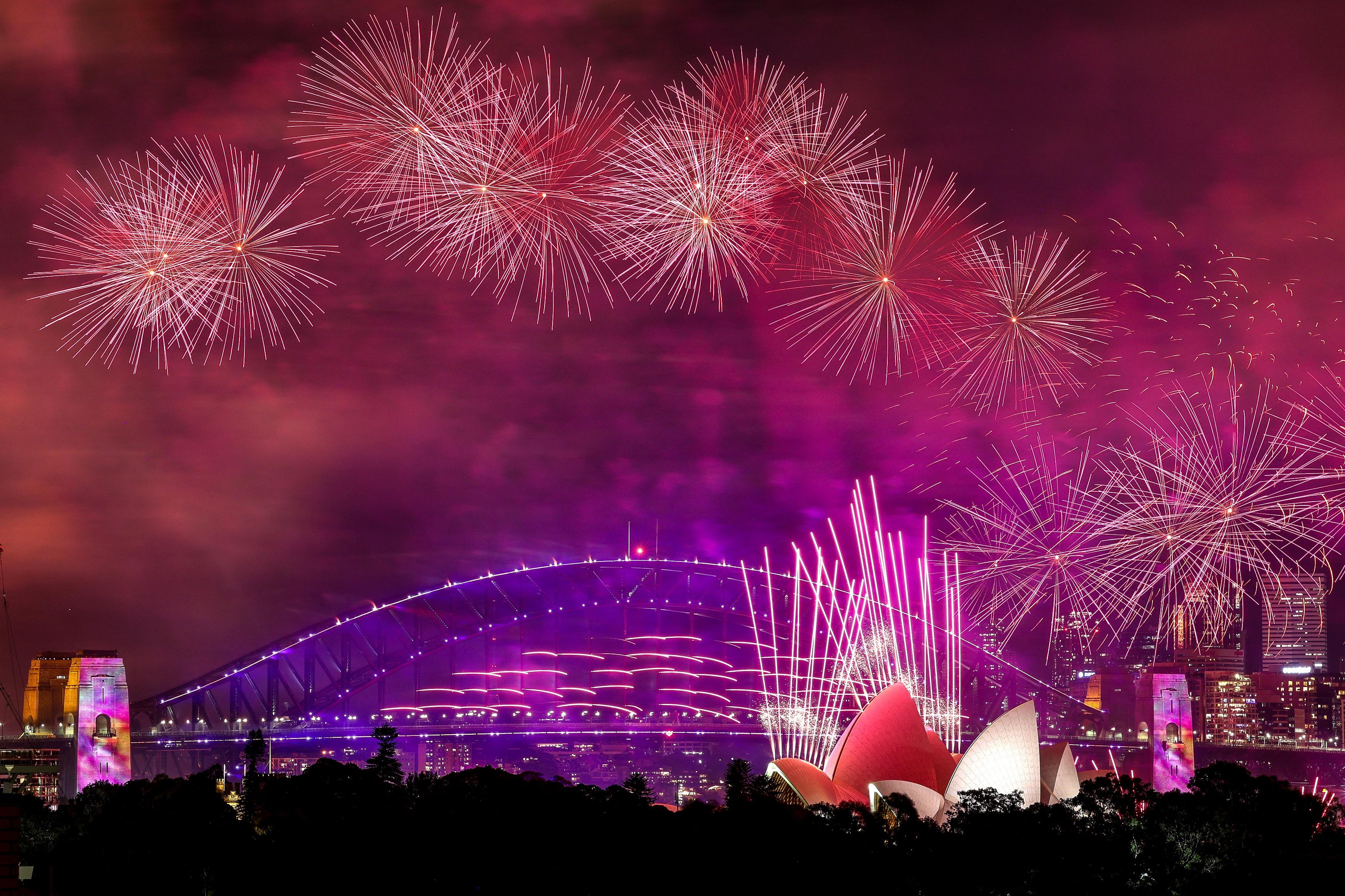 World welcomes 2024 with fireworks, reflection